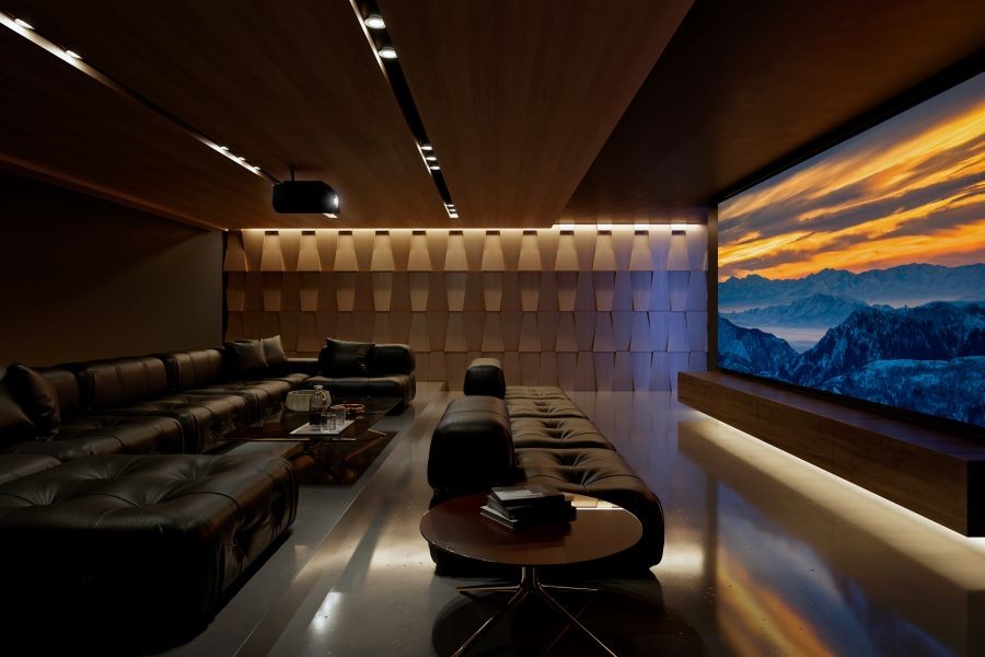 A home theater with a large movie screen, Sony projector, acoustic paneling, and tiered sectional seating.